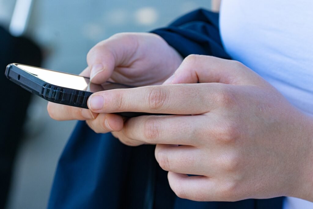 a close-up of hands holding a phone